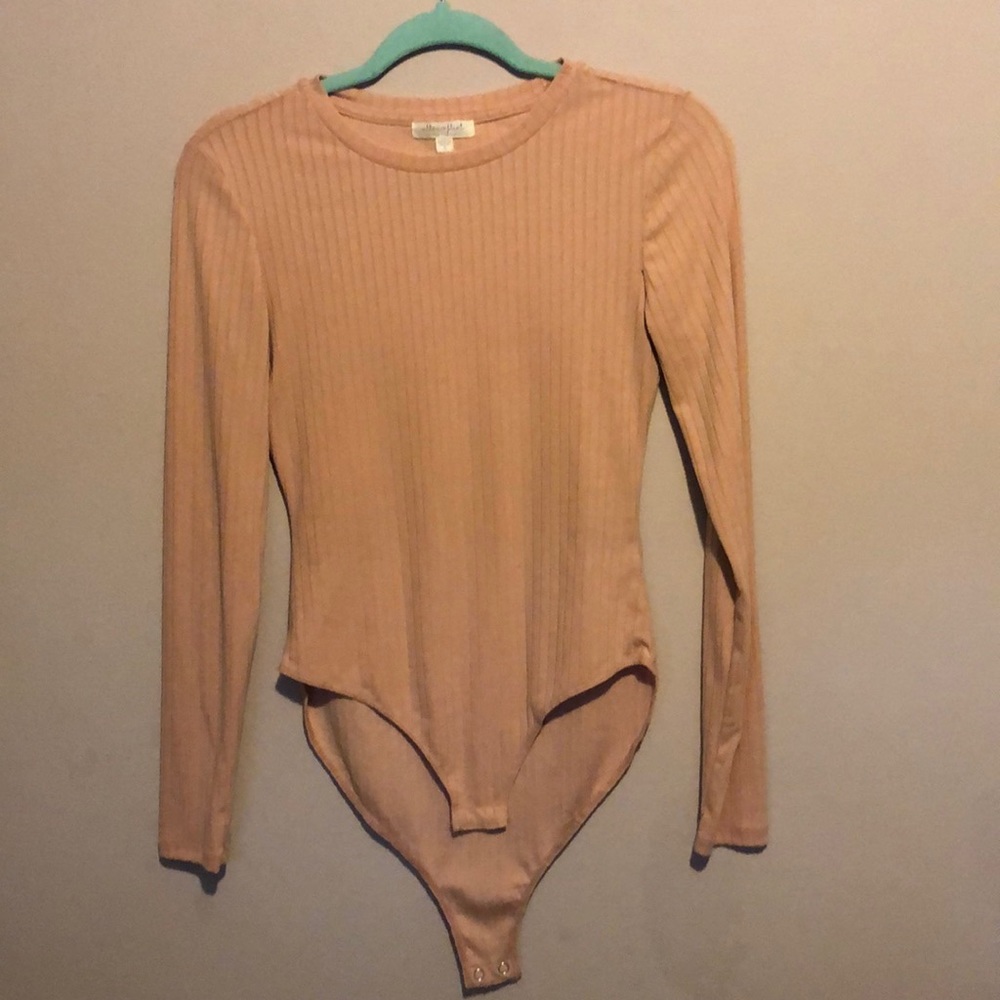 Ultra Flirt peach woman’s body suit with long sleeves